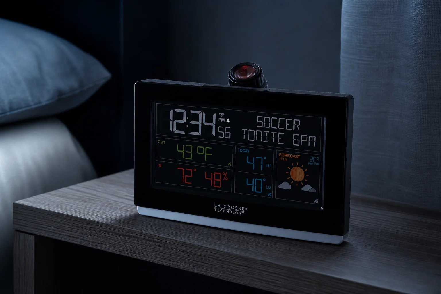 La Crosse C82929v2 alarm clock with a dimmed multicolor display on a bedside shelf