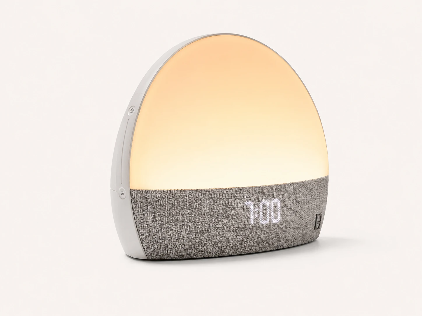 Side angle product view of Hatch Restore Smart Alarm Clock showing its curved design