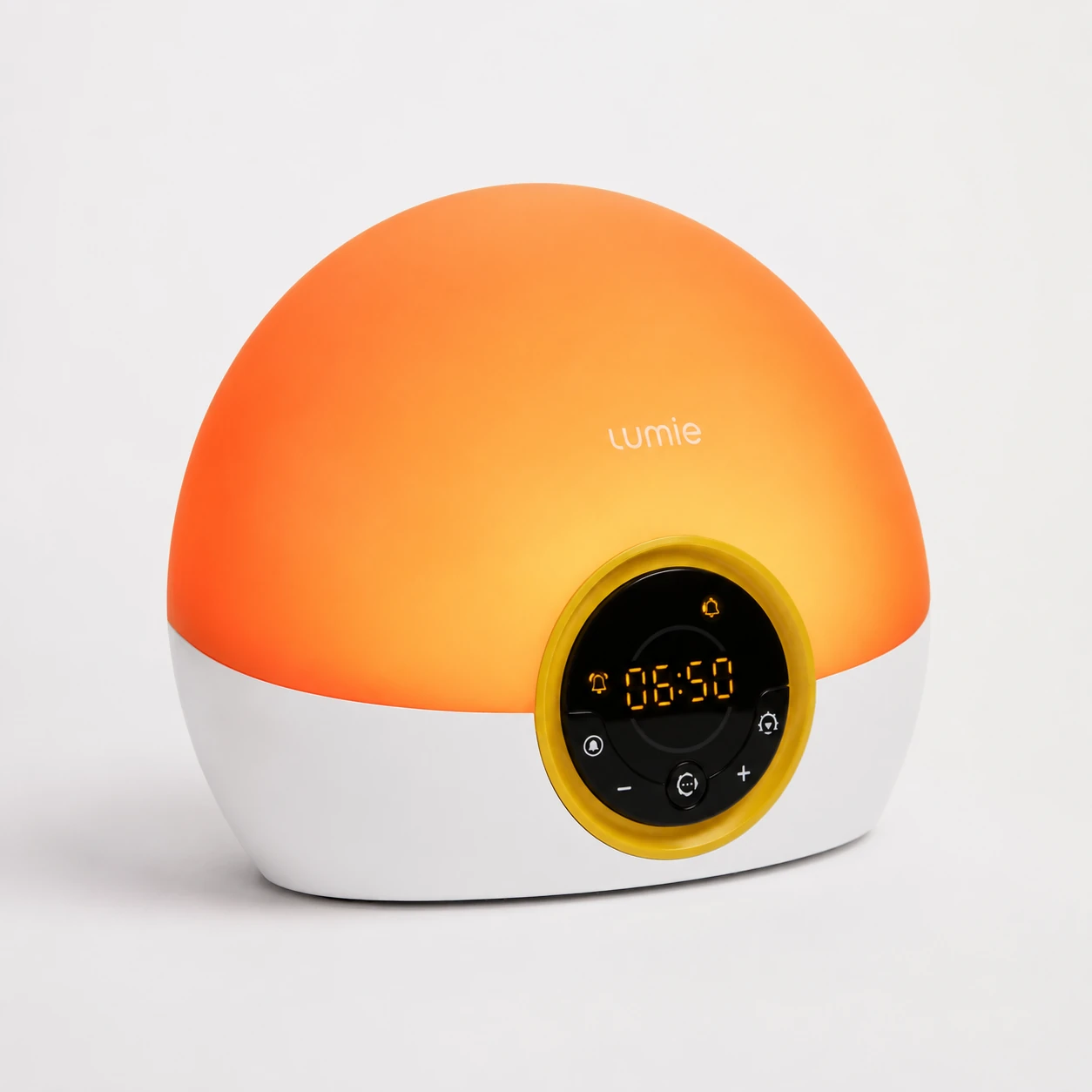 Angled studio product image of the Lumie Bodyclock Rise100 sunrise alarm clock with orange glow on a light background.